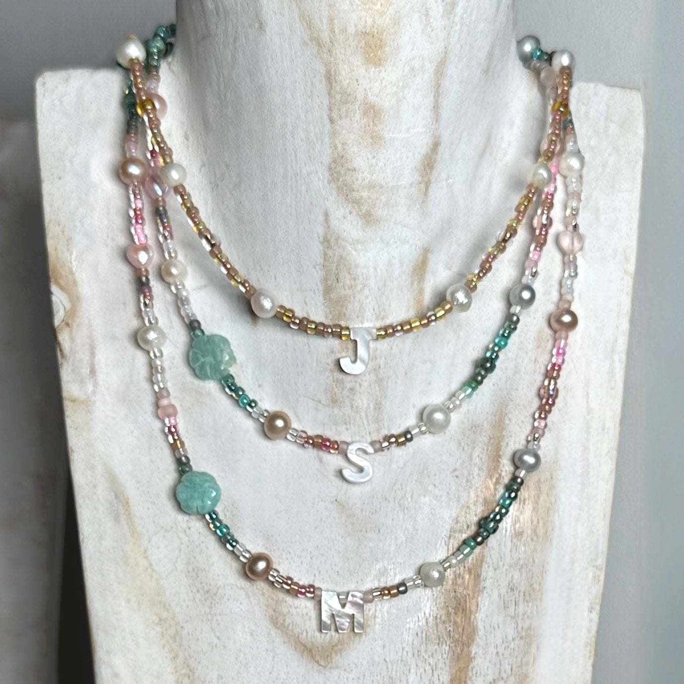 Rosy Glow Pearl Letter Necklace