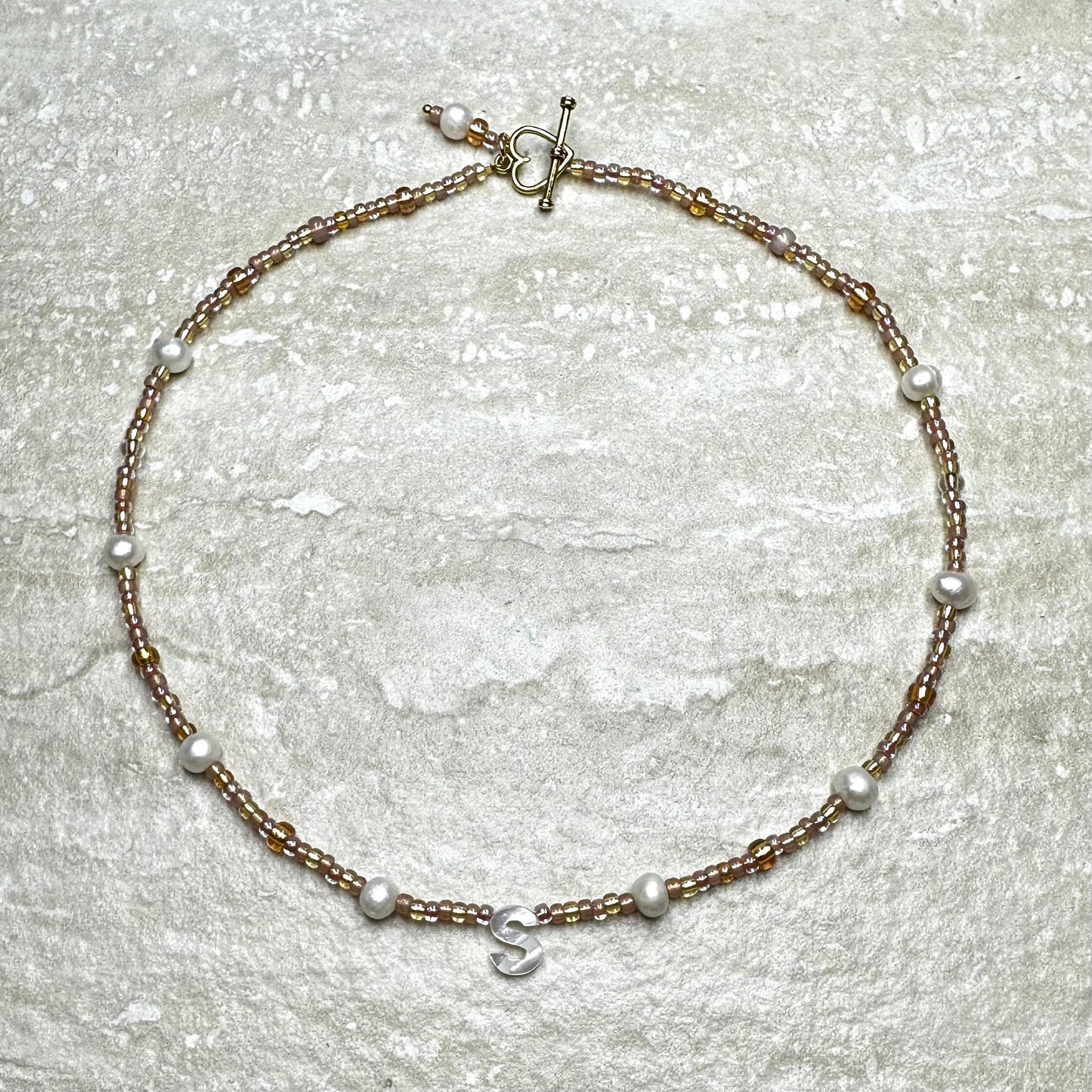 Rosy Glow Pearl Letter Necklace