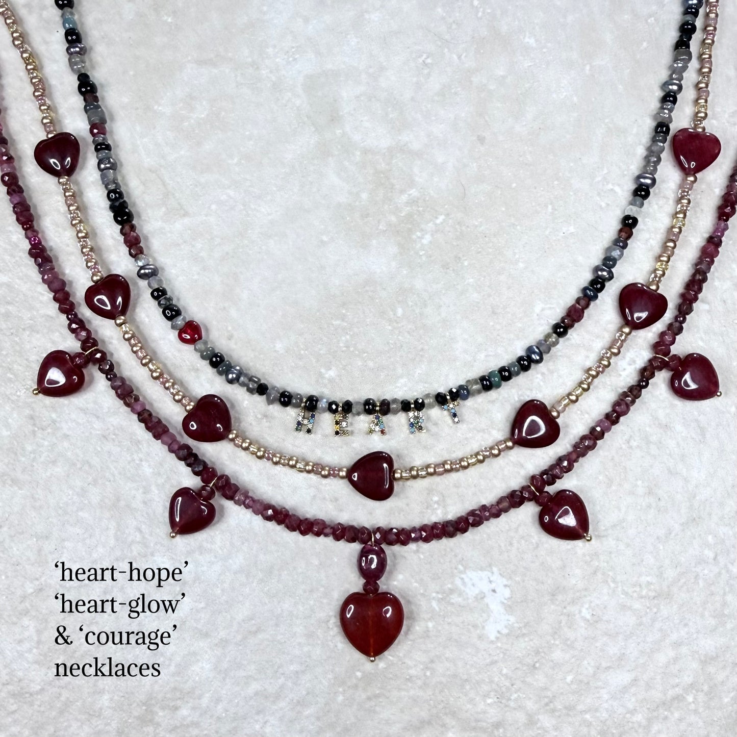 Chain of Hope ‘Wear Your Heart’ Courage Heart Necklace | Ruby, Garnet & Pink Tourmaline Necklace | Handmade Gemstone Jewellery | CLARKE PALMER