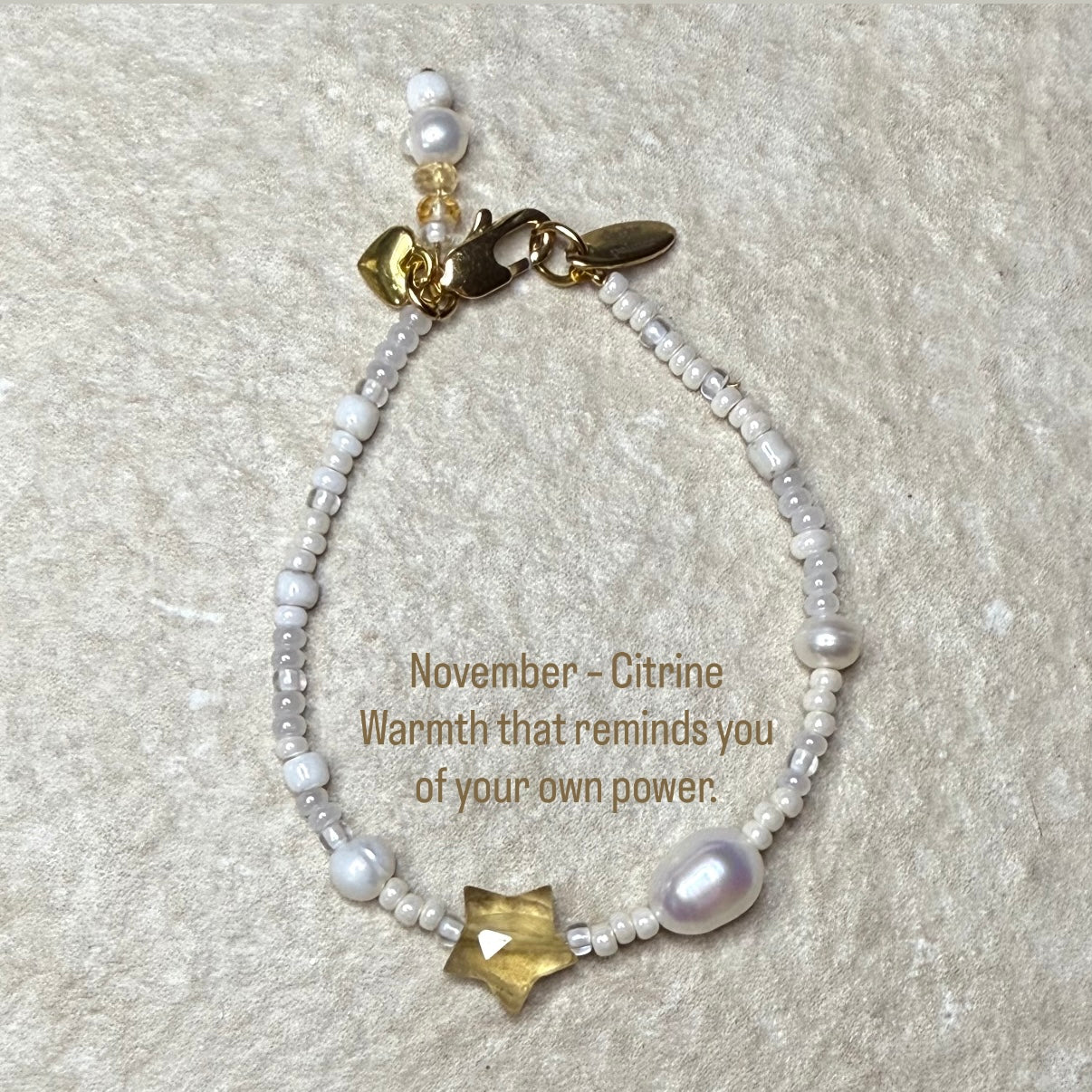 Pearl & Citrine Star Birthstone Bracelet with Quote: November – Citrine
Warmth that reminds you of your own life and power.