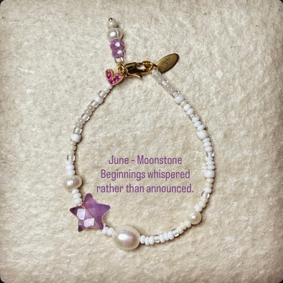 Pearl & lilac Moonstone Star Birthstone Bracelet with quote:
June – Moonstone
Beginnings whispered rather than announced.